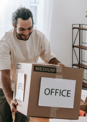 Man carrying a labeled office box